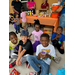 A group of children looking into the camera and grinning.