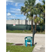 Construction site from across the street with a chair and mailbox next to the road.