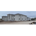 Outside views of a building with some building materials in front