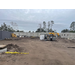 Construction equipment and a storage container along with building materials.