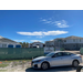 Outside view of Cypress Gardens Development over a fence and a car.