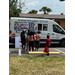 Kids lined up for ice cream.