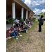 Kids sitting outside.