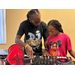  A young girl smiling with the DJ. 