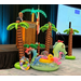  A man talking into a microphone on a podium up on stage with palm tree inflatables and other inflatables in front of it. 
