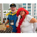  Becky-Sue dressed up with a hat and posing for a photo with a man by a table. 